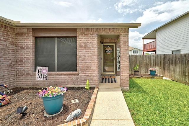 5504 Alomar Cv, Del Valle, TX 78617 - doorway to property featuring brick siding