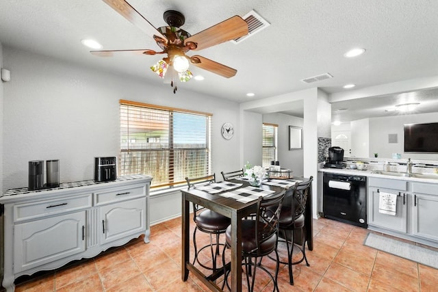5504 Alomar Cv, Del Valle, TX 78617 - dining space featuring light tile patterned flooring, ceiling fan, recessed lighting, and a textured ceiling