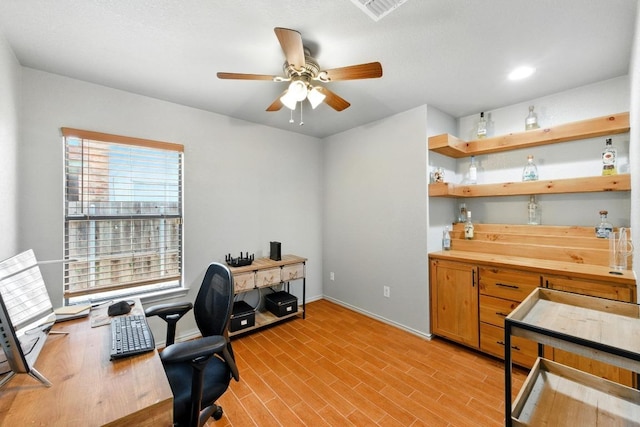 5504 Alomar Cv, Del Valle, TX 78617 - office featuring a ceiling fan, baseboards, and light wood-style flooring