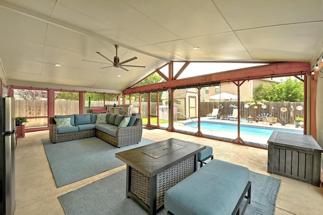 5504 Alomar Cv, Del Valle, TX 78617 - carpeted living area with lofted ceiling, ceiling fan, and plenty of natural light