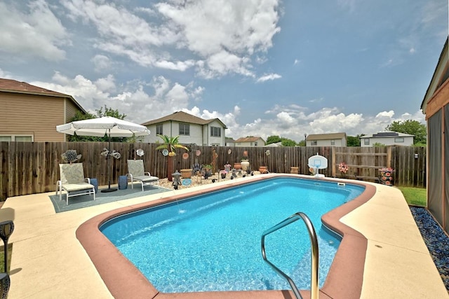 5504 Alomar Cv, Del Valle, TX 78617 - view of swimming pool with a fenced backyard and a patio area