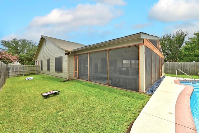 5504 Alomar Cv, Del Valle, TX 78617 - rear view of property with a sunroom
