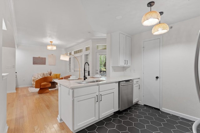 9525 N Capital Of Texas Hwy Unit 617, Austin, TX 78759 - kitchen featuring a sink, dishwasher, a peninsula, white cabinetry, and light countertops