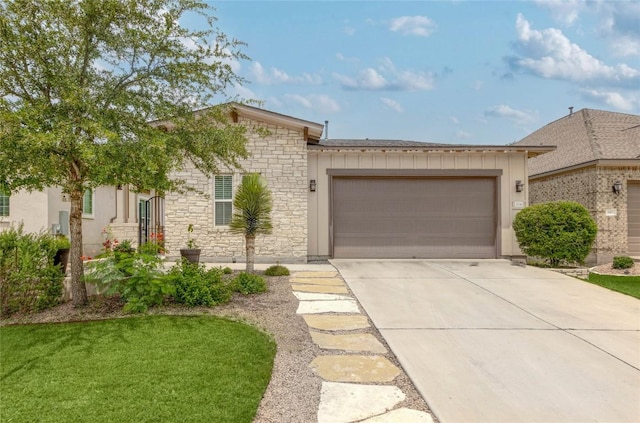 204 Hopping Peach St, San Marcos, TX 78666 - view of front of property featuring stone siding, a garage, concrete driveway, and board and batten siding