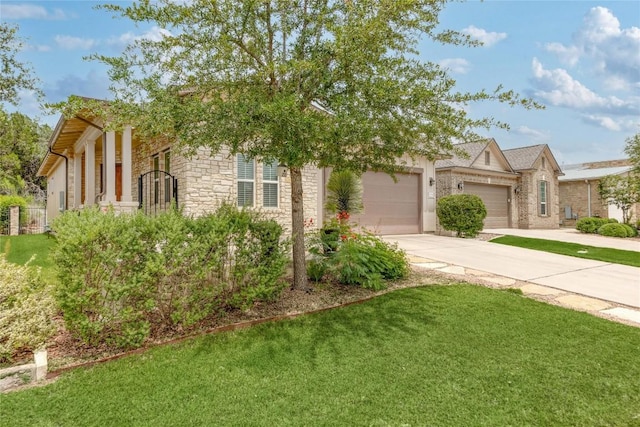204 Hopping Peach St, San Marcos, TX 78666 - view of front of home featuring stone siding, concrete driveway, an attached garage, and a front lawn