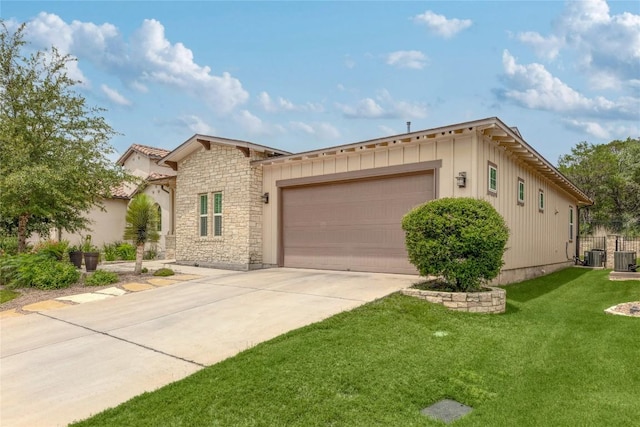 204 Hopping Peach St, San Marcos, TX 78666 - view of front of home featuring stone siding, driveway, board and batten siding, and a front lawn