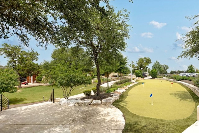 204 Hopping Peach St, San Marcos, TX 78666 - view of home's community with a putting area and a patio area