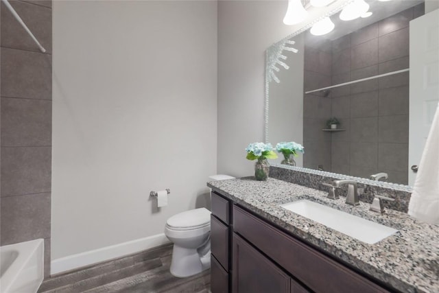 204 Hopping Peach St, San Marcos, TX 78666 - full bath featuring wood finished floors, toilet, vanity, and baseboards