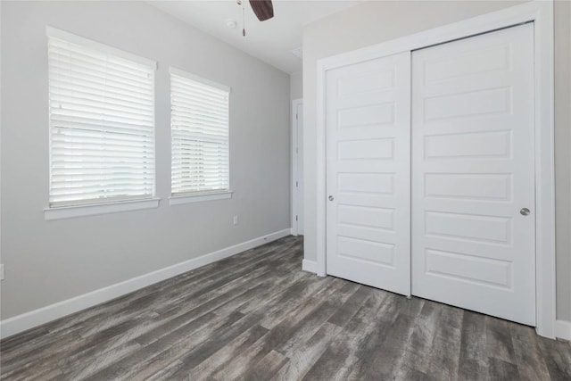 204 Hopping Peach St, San Marcos, TX 78666 - unfurnished bedroom featuring dark wood-style flooring, a closet, baseboards, and ceiling fan