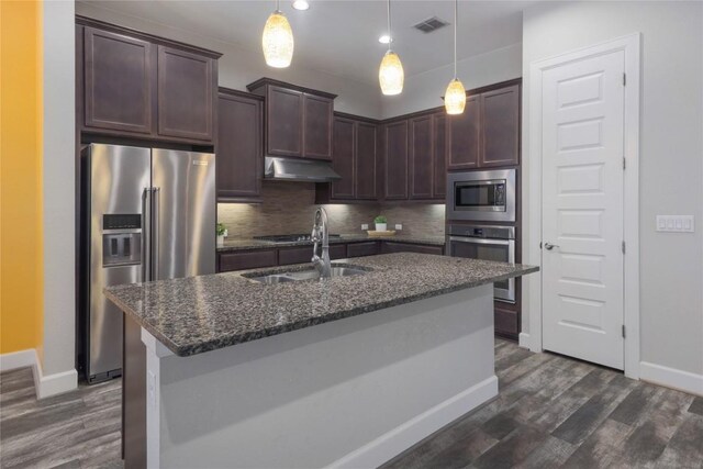 204 Hopping Peach St, San Marcos, TX 78666 - kitchen with appliances with stainless steel finishes, under cabinet range hood, dark brown cabinets, and baseboards