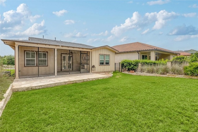 204 Hopping Peach St, San Marcos, TX 78666 - rear view of house featuring a patio area, a ceiling fan, a lawn, and board and batten siding