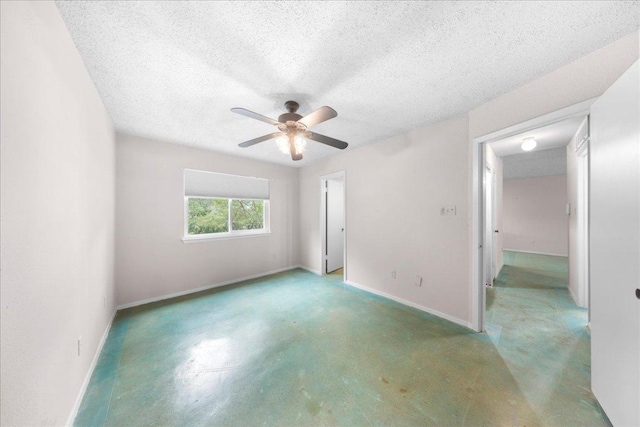 1015 E Yager Ln Unit 187, Austin, TX 78753 - unfurnished bedroom with baseboards, a textured ceiling, and ceiling fan