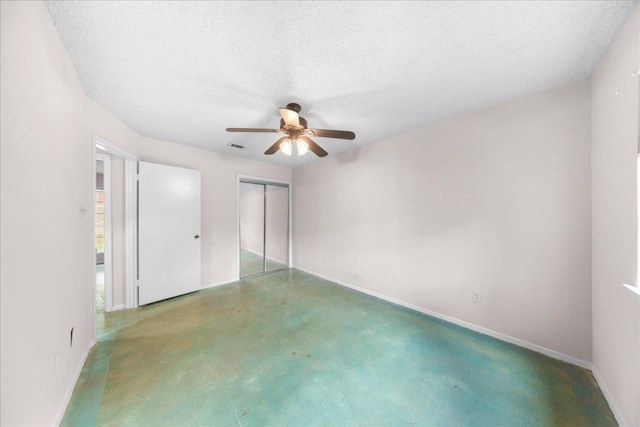 1015 E Yager Ln Unit 187, Austin, TX 78753 - unfurnished bedroom featuring a closet, ceiling fan, baseboards, and a textured ceiling