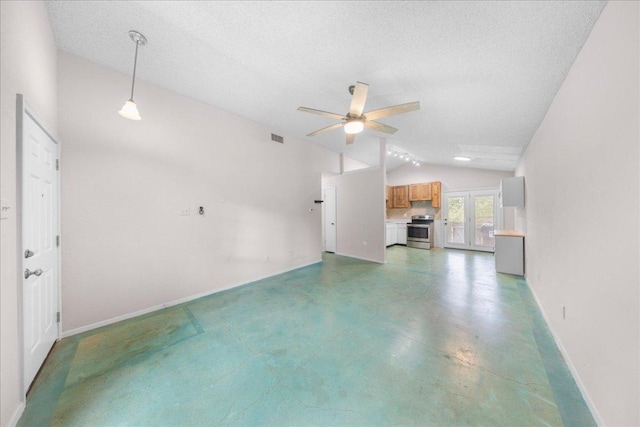 1015 E Yager Ln Unit 187, Austin, TX 78753 - unfurnished living room with lofted ceiling, ceiling fan, baseboards, a textured ceiling, and finished concrete flooring