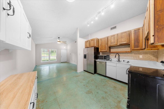 1015 E Yager Ln Unit 187, Austin, TX 78753 - kitchen with appliances with stainless steel finishes, a sink, vaulted ceiling, ceiling fan, and open floor plan