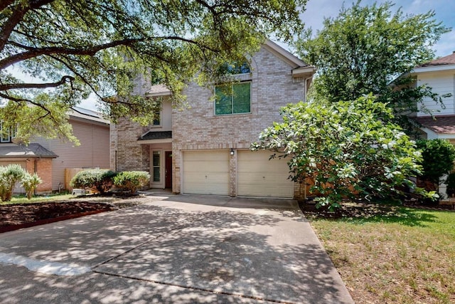 1115 Byers Ln, Austin, TX 78753 - view of front facade with brick siding, concrete driveway, and a garage