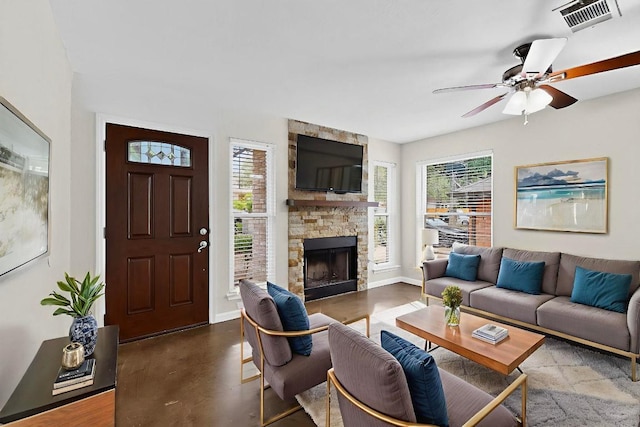 1115 Byers Ln, Austin, TX 78753 - living room featuring a fireplace, ceiling fan, and baseboards
