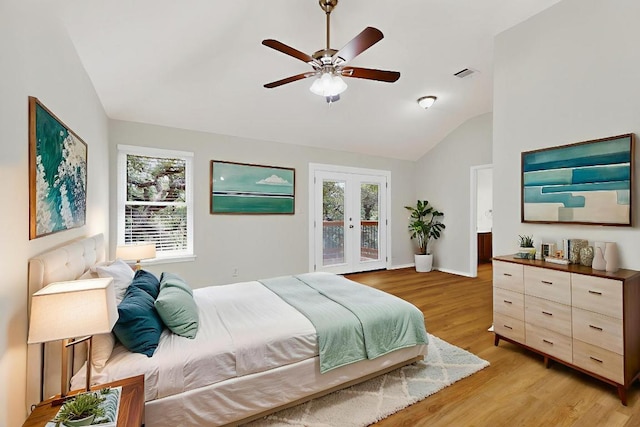 1115 Byers Ln, Austin, TX 78753 - bedroom featuring vaulted ceiling, access to outside, multiple windows, light wood-style floors, and french doors