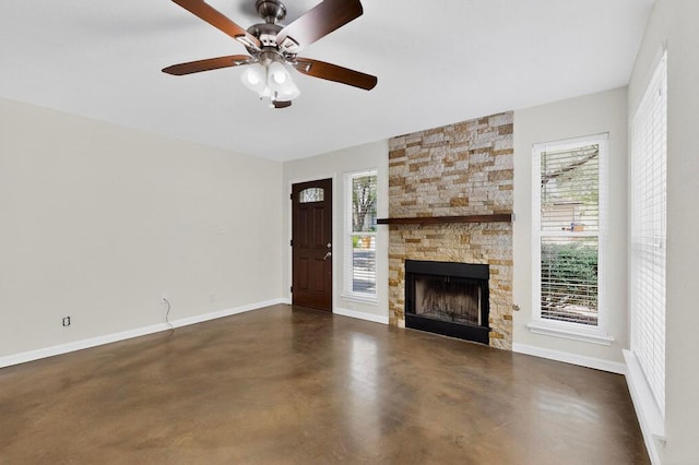1115 Byers Ln, Austin, TX 78753 - unfurnished living room featuring concrete flooring, baseboards, a fireplace, and ceiling fan