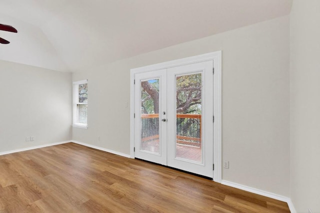1115 Byers Ln, Austin, TX 78753 - empty room featuring a ceiling fan, wood finished floors, french doors, vaulted ceiling, and baseboards