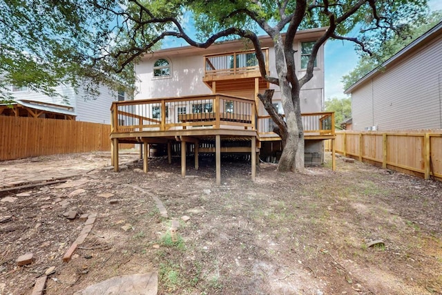 1115 Byers Ln, Austin, TX 78753 - back of house with a wooden deck and a fenced backyard