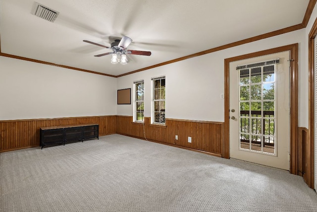 3 Hillview Dr, Round Rock, TX 78664 - empty room with a wainscoted wall, a ceiling fan, plenty of natural light, carpet floors, and ornamental molding