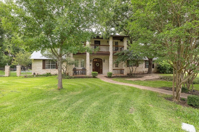 3 Hillview Dr, Round Rock, TX 78664 - view of front facade featuring stone siding, a balcony, and covered porch