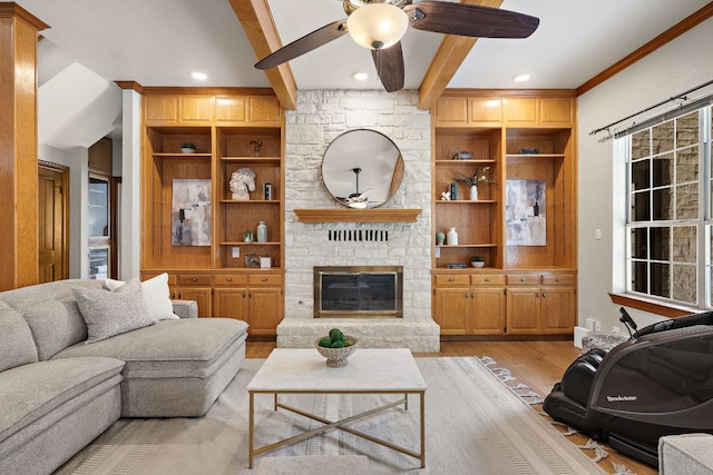 3 Hillview Dr, Round Rock, TX 78664 - living area featuring ceiling fan, light wood finished floors, beam ceiling, a fireplace, and built in features