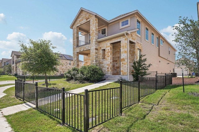 202 Delaware Mountains Ter, Dripping Springs, TX 78620 - contemporary home featuring stone siding, a balcony, and central air condition unit