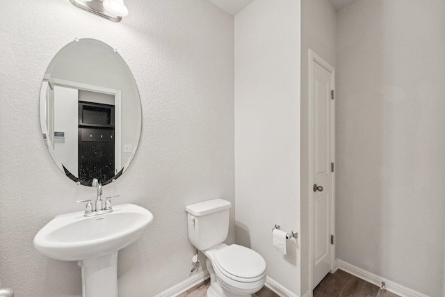 202 Delaware Mountains Ter, Dripping Springs, TX 78620 - half bath featuring toilet and baseboards