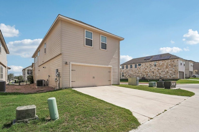 202 Delaware Mountains Ter, Dripping Springs, TX 78620 - view of side of property featuring an attached garage, cooling unit, a lawn, and concrete driveway