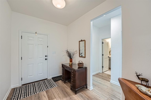 12904 Cerro Castellan Trce, Manor, TX 78653 - entryway featuring light wood-style flooring and baseboards