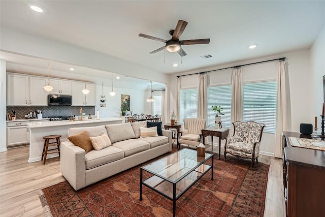 12904 Cerro Castellan Trce, Manor, TX 78653 - living room featuring ceiling fan, light wood-style floors, and recessed lighting