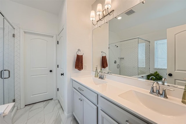 12904 Cerro Castellan Trce, Manor, TX 78653 - bathroom with a stall shower, double vanity, and marble look tiles