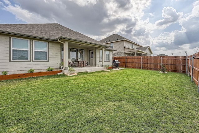 12904 Cerro Castellan Trce, Manor, TX 78653 - back of property featuring a patio and a shingled roof