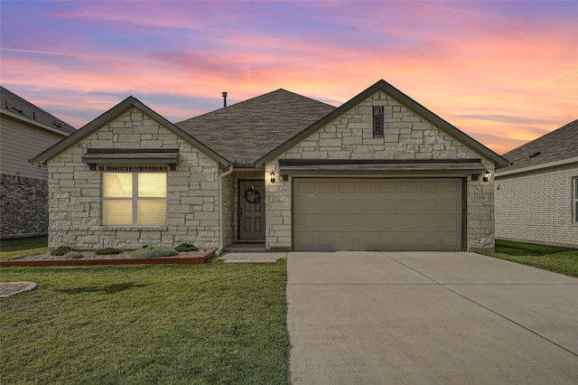 12904 Cerro Castellan Trce, Manor, TX 78653 - french country inspired facade with stone siding, driveway, an attached garage, a front yard, and a shingled roof