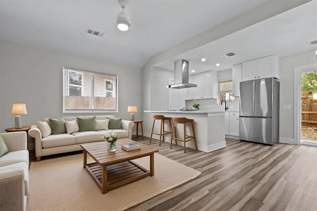 4913 Single Shot Cir, Austin, TX 78723 - living room with light wood finished floors and recessed lighting