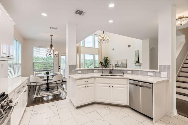 4508 Three Arrows Ct, Cedar Park, TX 78613 - kitchen with stainless steel appliances, a sink, a chandelier, light marble finish floors, and recessed lighting