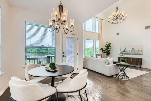 4508 Three Arrows Ct, Cedar Park, TX 78613 - dining space with a chandelier, wood finished floors, baseboards, and a high ceiling