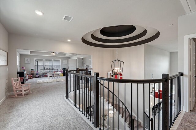 17804 Hattie Trce, Austin, TX 78738 - hall with an upstairs landing, carpet, recessed lighting, and a chandelier