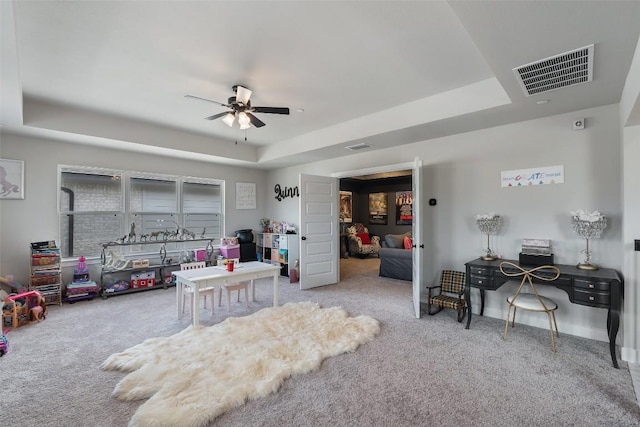 17804 Hattie Trce, Austin, TX 78738 - carpeted bedroom with a tray ceiling, a ceiling fan, and baseboards