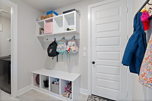 17804 Hattie Trce, Austin, TX 78738 - mudroom featuring baseboards, washer / clothes dryer, and light wood-style flooring