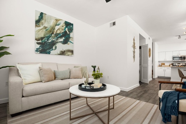 1201 Grove Blvd Unit 1103, Austin, TX 78741 - living area featuring dark wood finished floors and baseboards