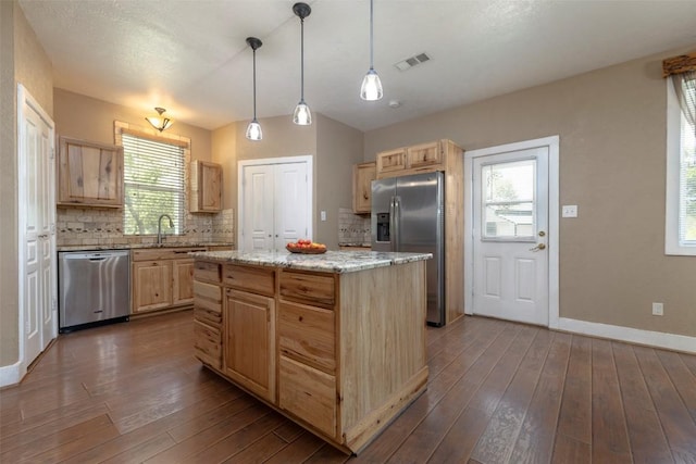 15055 Fm 32, Blanco, TX 78606 - kitchen featuring stainless steel appliances, light brown cabinets, and backsplash