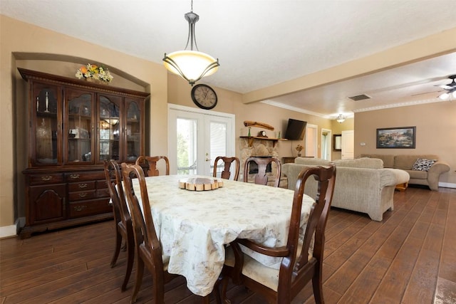 15055 Fm 32, Blanco, TX 78606 - dining area featuring french doors, dark wood-type flooring, a ceiling fan, and baseboards