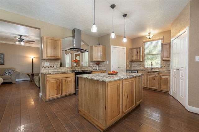 15055 Fm 32, Blanco, TX 78606 - kitchen featuring island exhaust hood, stainless steel range oven, a center island, and backsplash