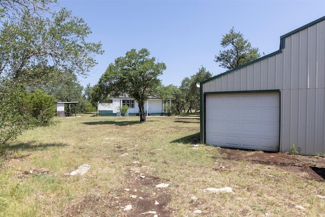 15055 Fm 32, Blanco, TX 78606 - view of green lawn with a garage