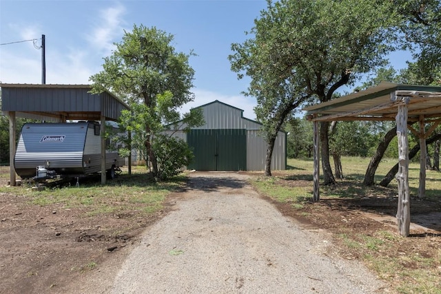 15055 Fm 32, Blanco, TX 78606 - view of pole building featuring driveway and a carport