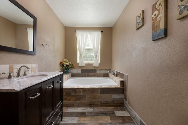 15055 Fm 32, Blanco, TX 78606 - full bath featuring vanity, a bath, and a textured wall