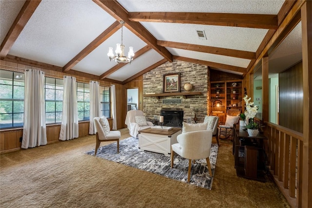 42 Laurel Hill St, Austin, TX 78737 - carpeted living area featuring a fireplace, a chandelier, wooden walls, and a textured ceiling